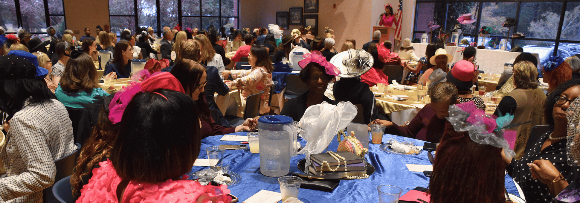 A room full of ladies having lunch together.